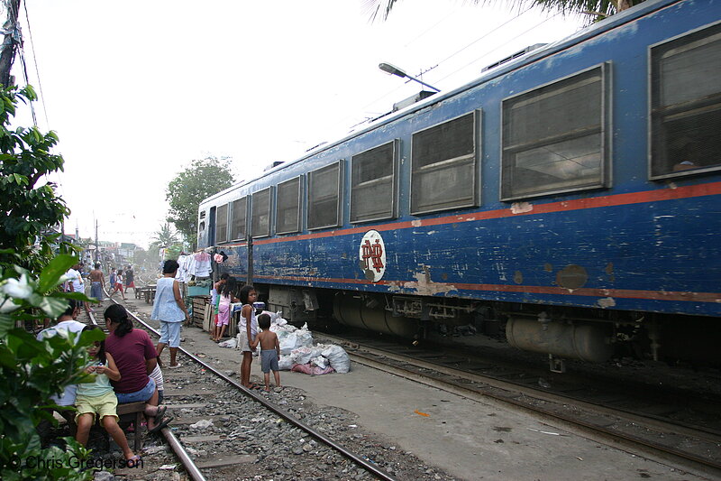 Photo of Train Passing Through Manila Neighborhood (4605)