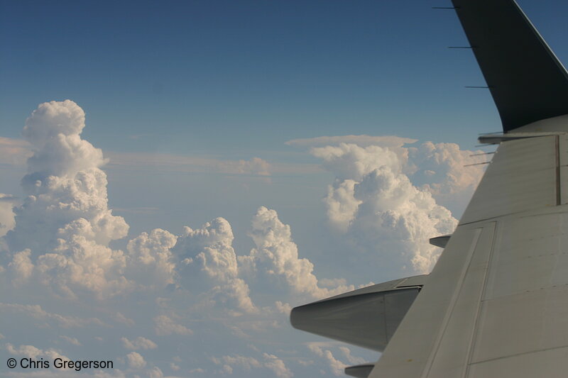 Photo of Clouds, Sky, and Wing During Airline Flight(4984)
