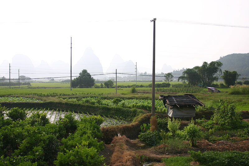 Photo of Rural Chinese Farm Fields Among Kurst Mountains(5070)