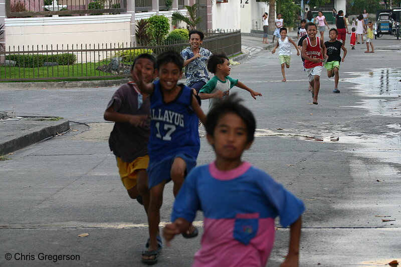 Photo of Children Running on a Street in Balibago town in Angeles City, Pampanga(5371)