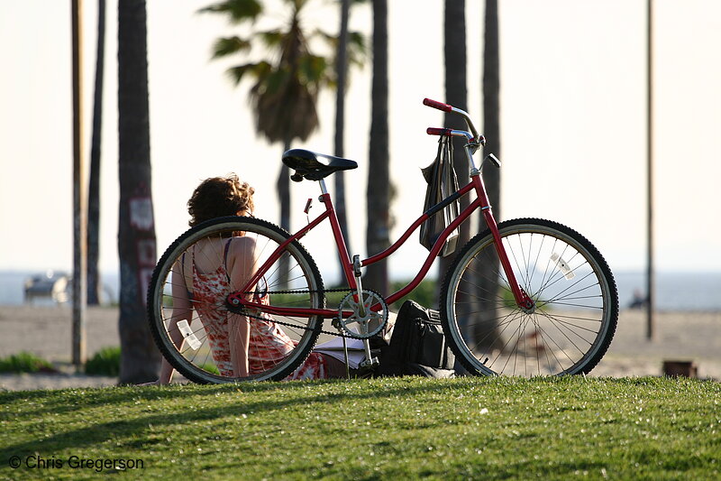 Photo of Woman Relaxing Next to Bike, Venice Beach, CA(5617)