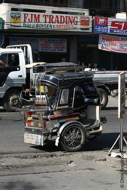 Photo of A Parked Tricycle Near Some Business Establishments(5713)