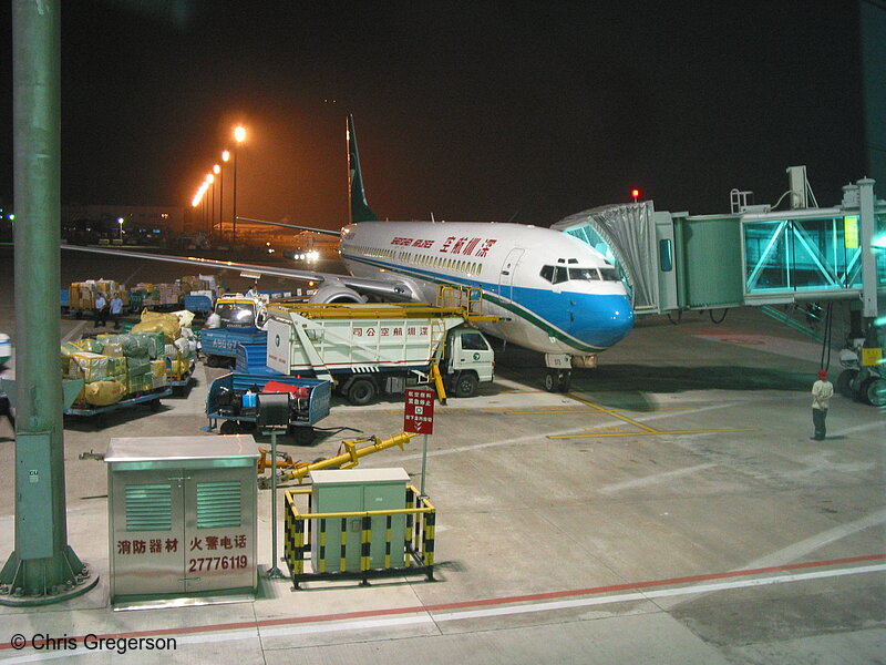 Photo of Plane at a Gate at the Shenzhen Airport at Night(6169)